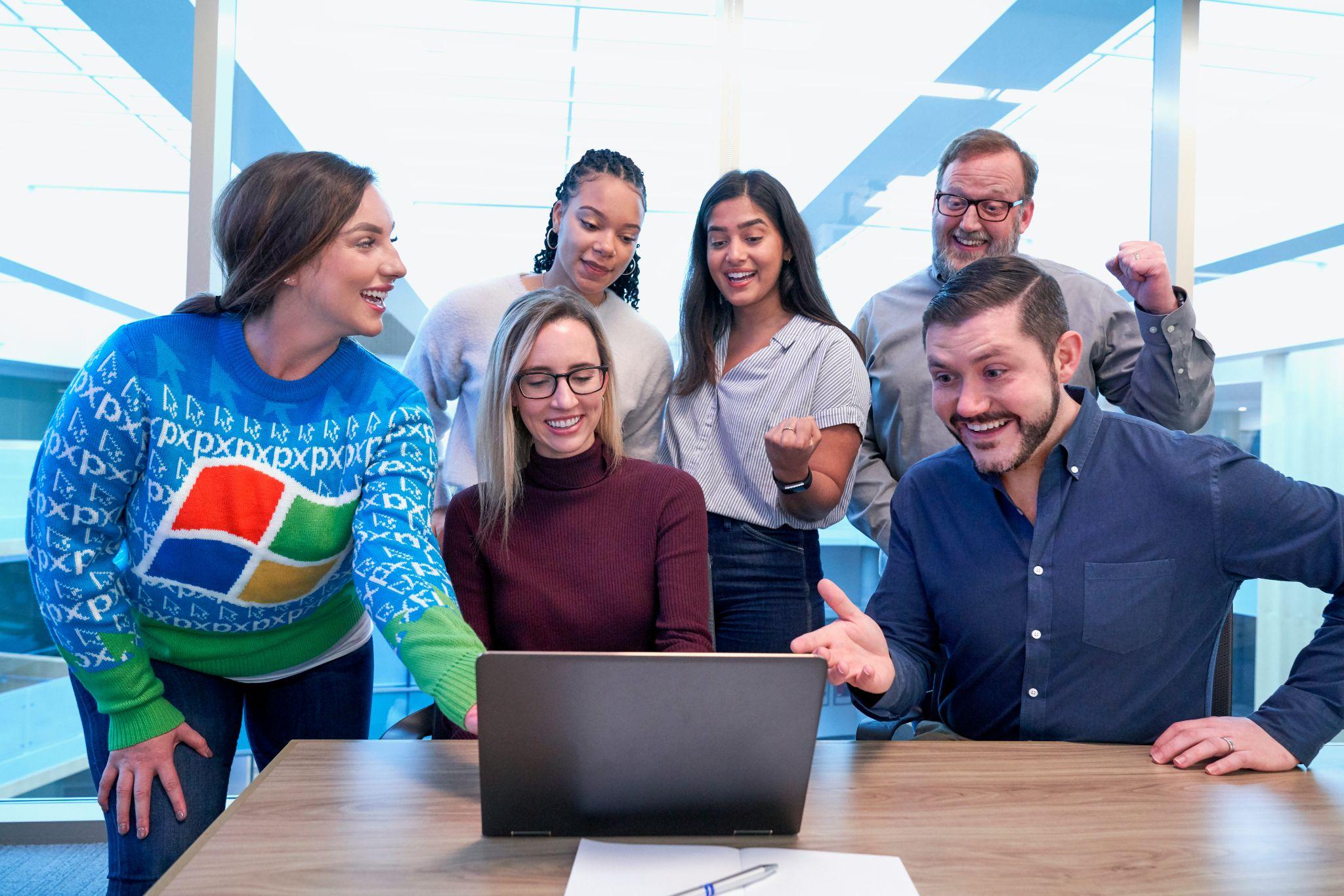 A team discusses group insurance services in California in an office.