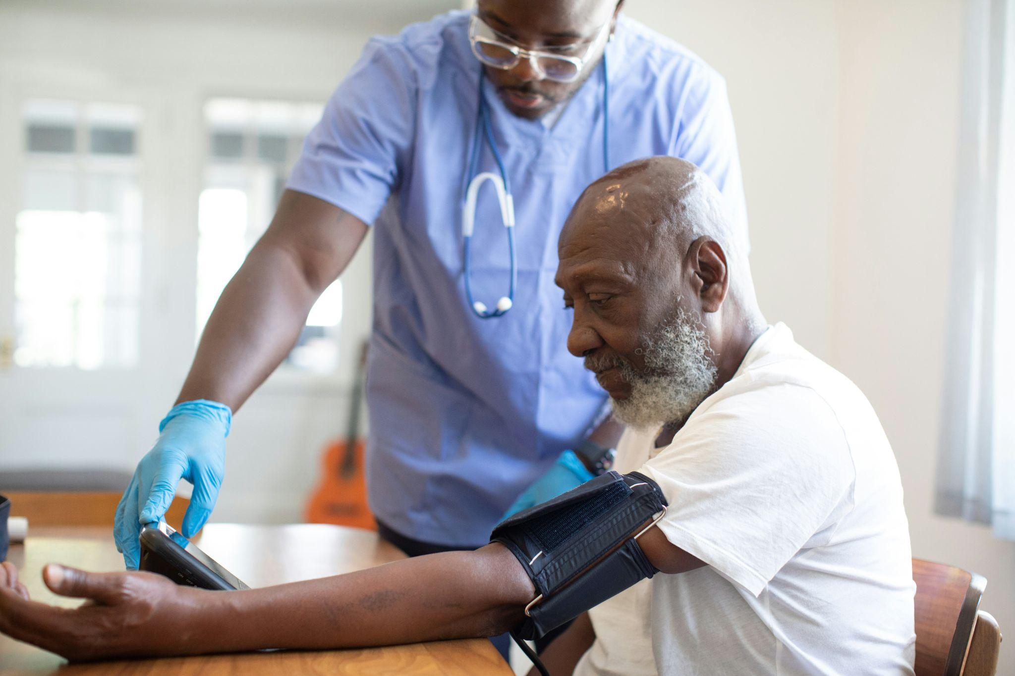 Medical professionals review patient information related to group health insurance in California.