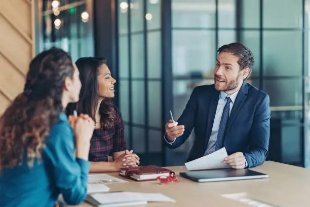 Professional explaining employee benefits of group vision insurance in California